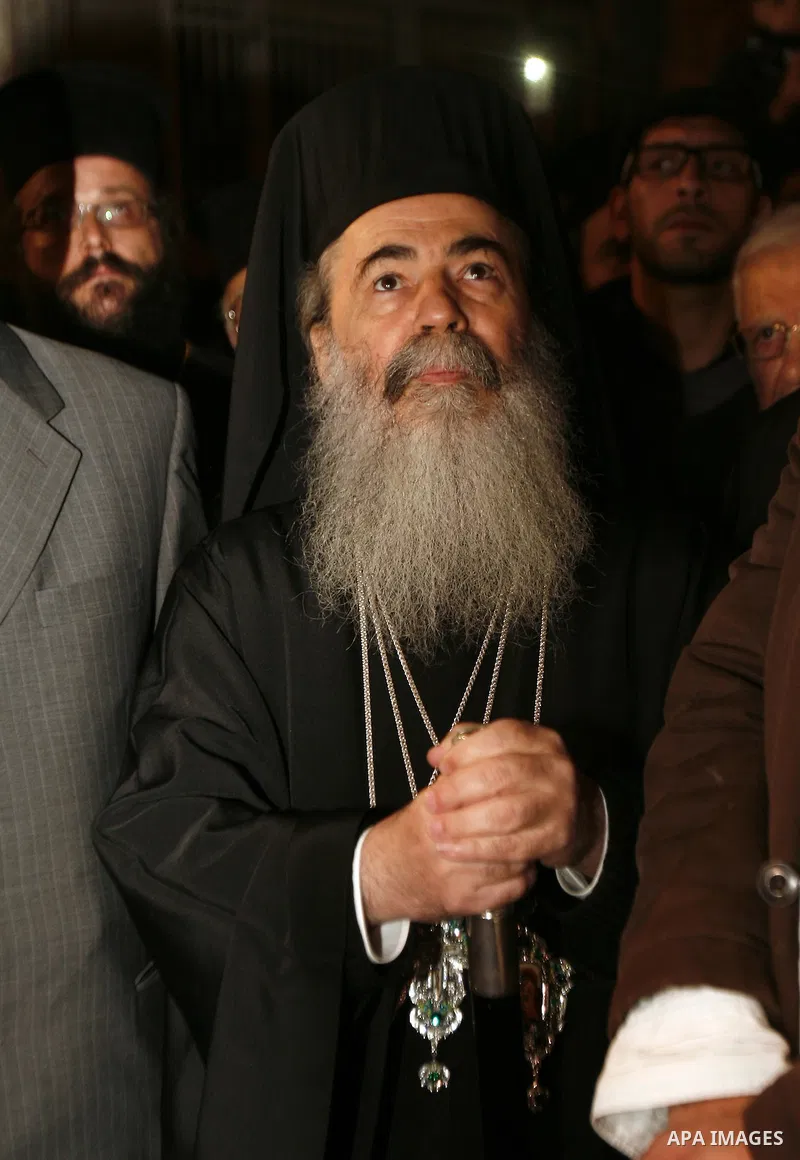 Greek Orthodox Patriarch of Jerusalem Theophilos III celebrates the lighting of the Christmas tree in the old city of Jerusalem, on December 16, 2012. Photo by Mahfouz Abu Turk