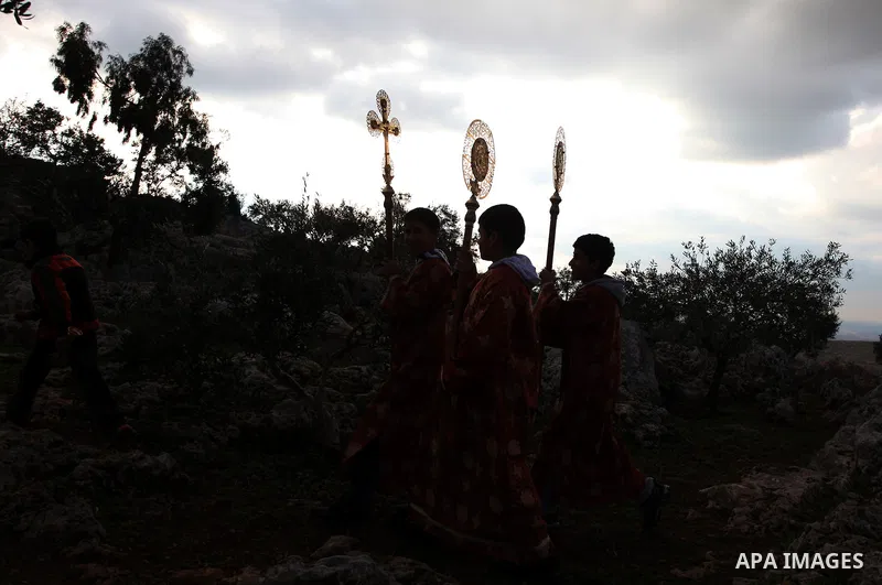 Palestinian Orthodox Christians return from the nearby ancient monastery of St. Barbara to the Palestinian village of Abud, in the Israeli occupied West Bank, during a parade to celebrate the annual festival of St. Barba...