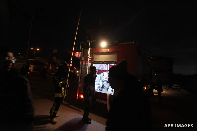 Palestinian firemen try to extinguish a fire after a fire broke out in a fuel tank at a filling station in Qalandia refugee camp near the West Bank city of Ramallah on 18 December 2012. Photo by Issam Rimawi