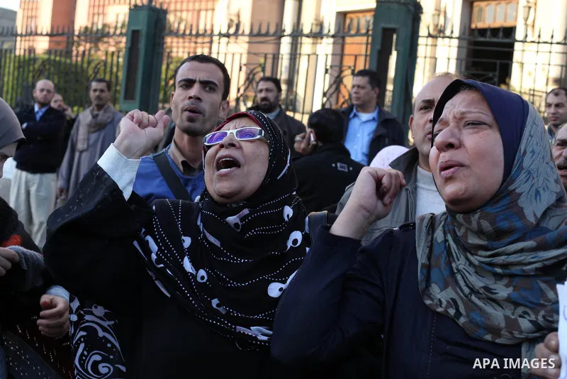 Egyptian protesters shout slogans against the President Mohamed Morsi and hold a banner reading in Arabic 'no to the constitution' during a demonstration against the draft constitution, in Cairo, Egypt, 18 December 2012....