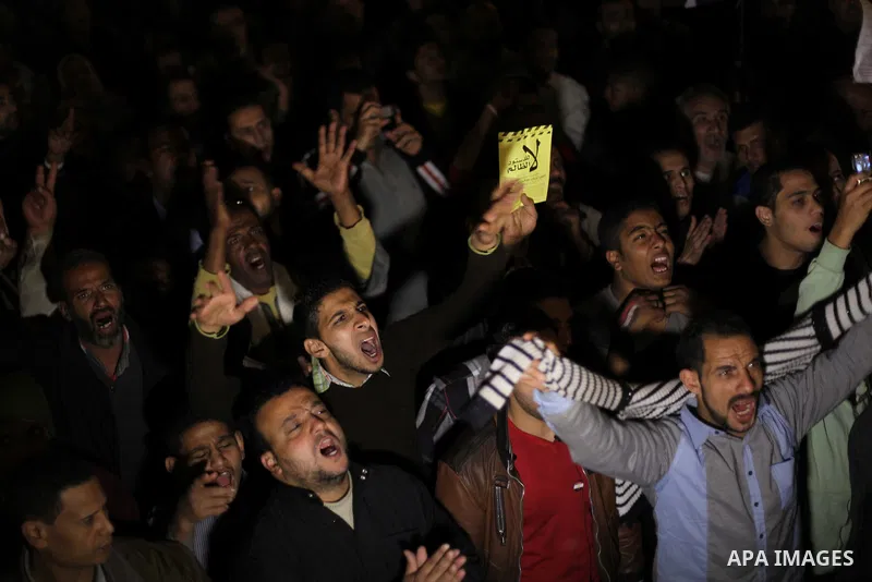 Protesters opposing Egypt's President Mohamed Mursi shout slogans as they demonstrate in front of the presidential palace in Cairo December 18, 2012. Opponents of Mursi staged protests in Cairo on Tuesday against an Isla...