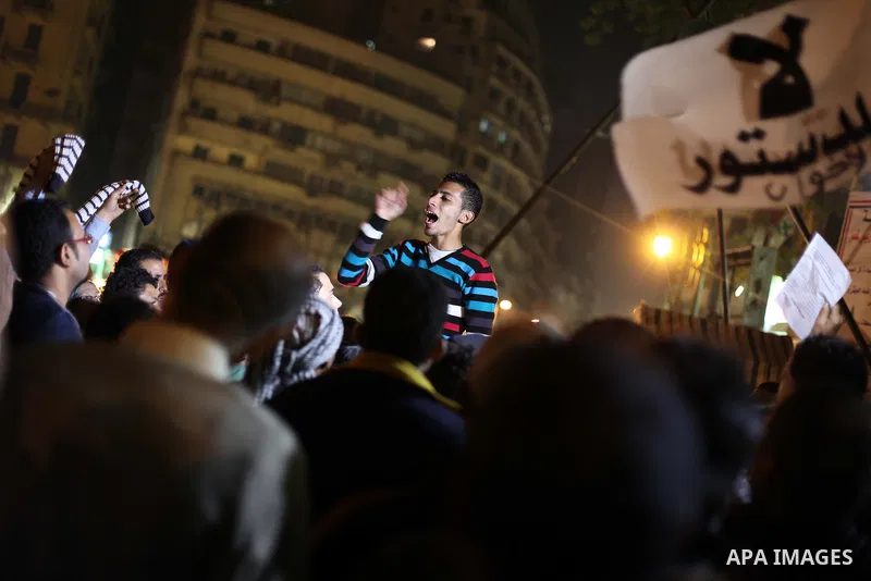 Protesters opposing Egypt's President Mohamed Mursi shout slogans as they demonstrate in front of the presidential palace in Cairo December 18, 2012. Opponents of Mursi staged protests in Cairo on Tuesday against an Isla...