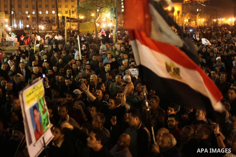 Protesters opposing Egypt's President Mohamed Mursi shout slogans as they demonstrate in front of the presidential palace in Cairo December 18, 2012. Opponents of Mursi staged protests in Cairo on Tuesday against an Isla...