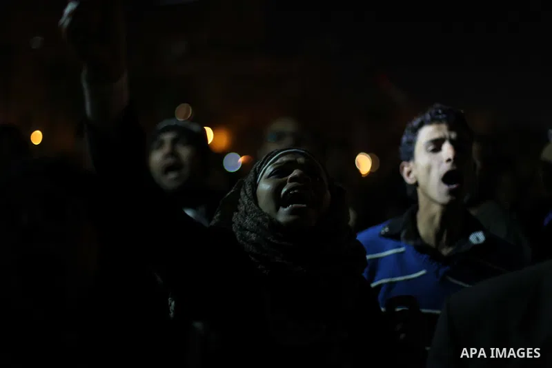 Protesters opposing Egypt's President Mohamed Mursi shout slogans as they demonstrate in front of the presidential palace in Cairo December 18, 2012. Opponents of Mursi staged protests in Cairo on Tuesday against an Isla...