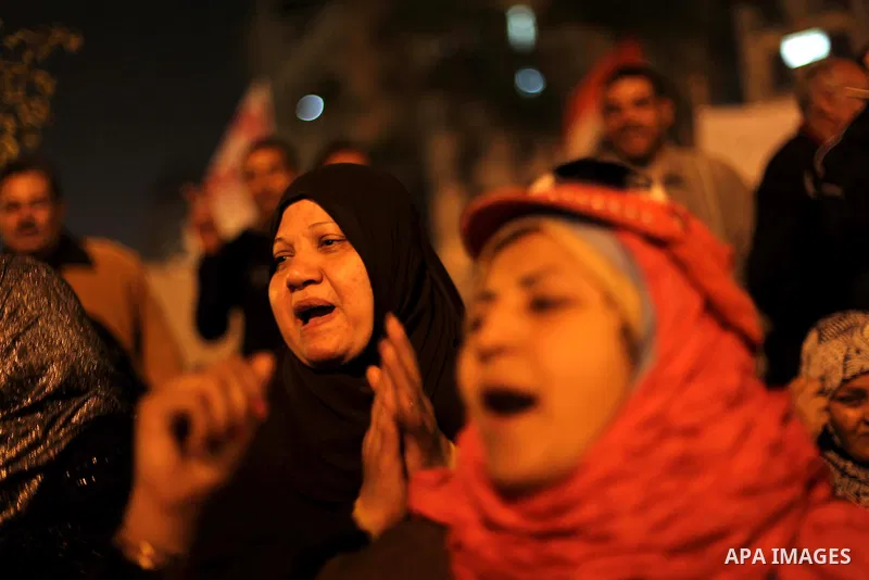 Protesters opposing Egypt's President Mohamed Mursi shout slogans as they demonstrate in front of the presidential palace in Cairo December 18, 2012. Opponents of Mursi staged protests in Cairo on Tuesday against an Isla...