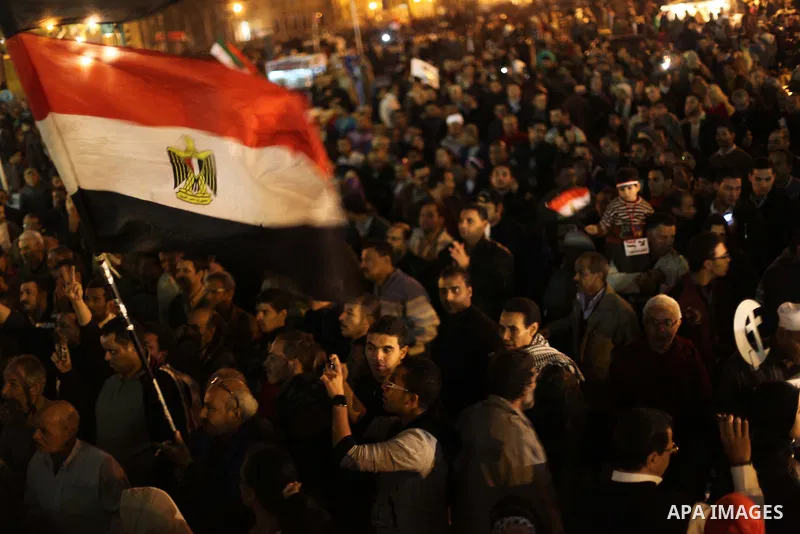 Protesters opposing Egypt's President Mohamed Mursi shout slogans as they demonstrate in front of the presidential palace in Cairo December 18, 2012. Opponents of Mursi staged protests in Cairo on Tuesday against an Isla...