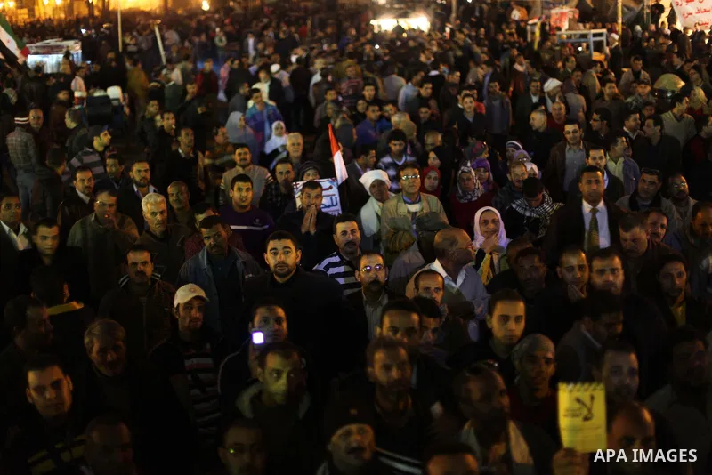 Protesters opposing Egypt's President Mohamed Mursi shout slogans as they demonstrate in front of the presidential palace in Cairo December 18, 2012. Opponents of Mursi staged protests in Cairo on Tuesday against an Isla...