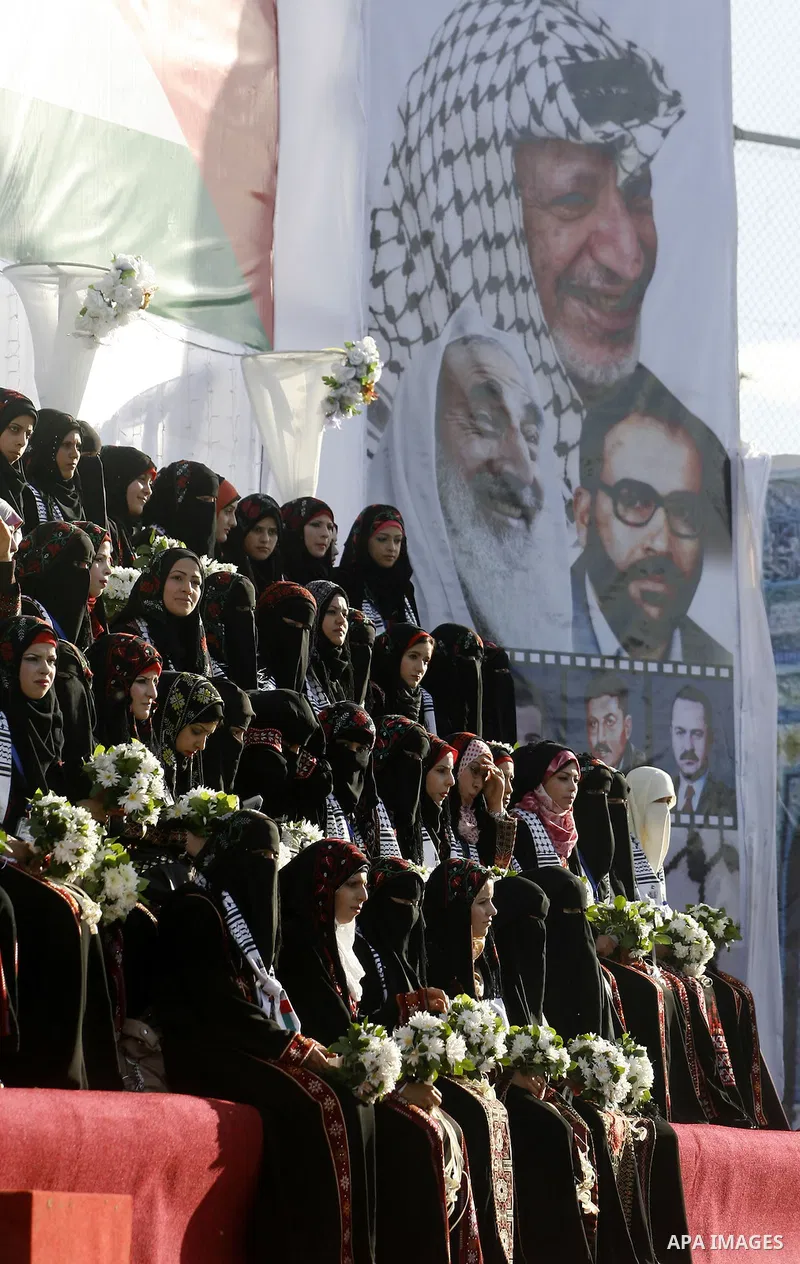 Palestinian brides pose during a mass wedding ceremony in Rafah southern Gaza strip, on December 19, 2012. The mass wedding organized by National Islamic Committee and funding by the institution of Sheikh Khalifa bin Zay...