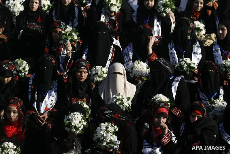 Palestinian brides pose during a mass wedding ceremony in Rafah southern Gaza strip, on December 19, 2012. The mass wedding organized by National Islamic Committee and funding by the institution of Sheikh Khalifa bin Zay...