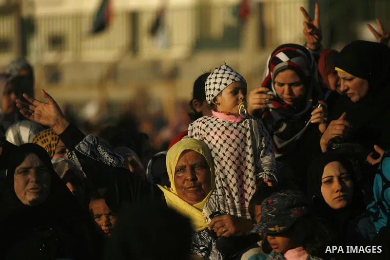 Palestinians attend a mass wedding ceremony in Rafah southern Gaza strip, on December 19, 2012. The mass wedding organized by National Islamic Committee and funding by the institution of Sheikh Khalifa bin Zayed bin Al N...