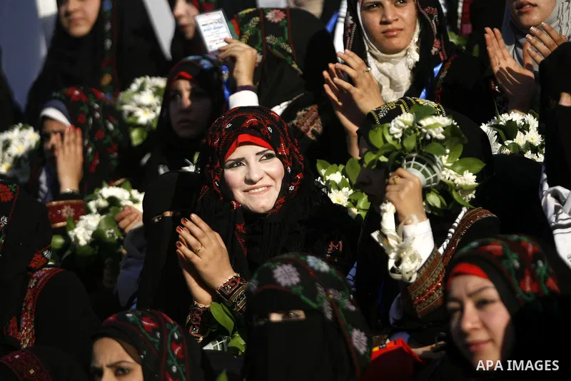 Palestinian brides pose during a mass wedding ceremony in Rafah southern Gaza strip, on December 19, 2012. The mass wedding organized by National Islamic Committee and funding by the institution of Sheikh Khalifa bin Zay...