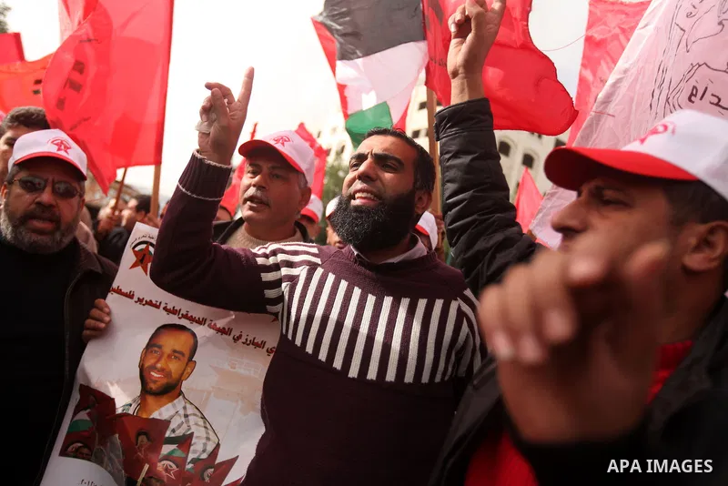 Supporters of the Popular Front for the Liberation of Palestine (PFLP) chant slogans during a demonstration in support of Palestinian prisoners held in Israeli jails, some of whom are observing a hunger strike, in Gaza c...