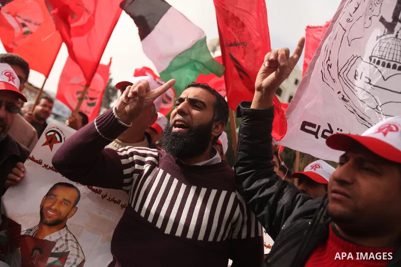 Supporters of the Popular Front for the Liberation of Palestine (PFLP) chant slogans during a demonstration in support of Palestinian prisoners held in Israeli jails, some of whom are observing a hunger strike, in Gaza c...