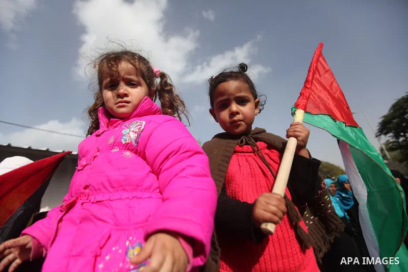Palestinian women chant slogans during a protest calling for stop against women violence by Israeli forces in Gaza City, on Dec. 20, 2012. Photo by Majdi Fathi