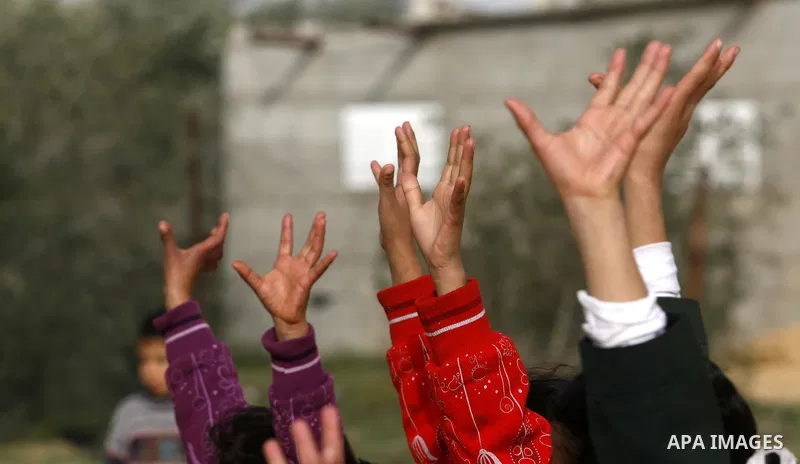 Palestinian children play during a leisure trip in Rafah refugee camp southern Gaza strip, on Dec. 20, 2012. The conflict between Israel and Gaza militant groups has claimed the lives of at least 23 children and Hundreds...