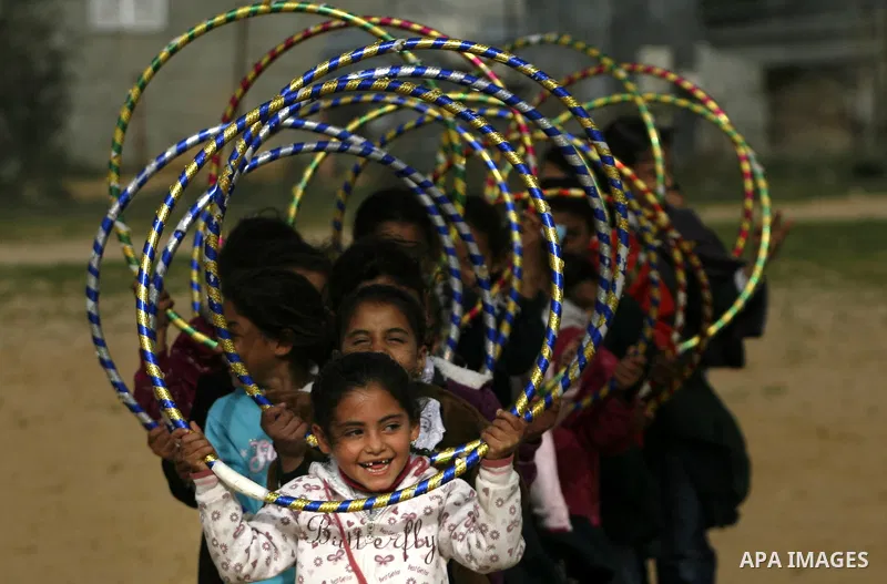 Palestinian children play during a leisure trip in Rafah refugee camp southern Gaza strip, on Dec. 20, 2012. The conflict between Israel and Gaza militant groups has claimed the lives of at least 23 children and Hundreds...