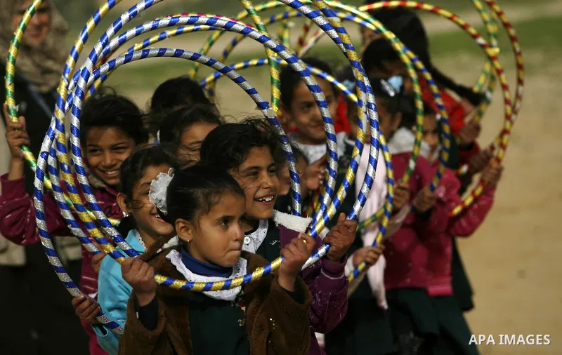 Palestinian children play during a leisure trip in Rafah refugee camp southern Gaza strip, on Dec. 20, 2012. The conflict between Israel and Gaza militant groups has claimed the lives of at least 23 children and Hundreds...