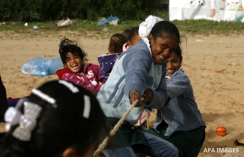 Palestinian children play during a leisure trip in Rafah refugee camp southern Gaza strip, on Dec. 20, 2012. The conflict between Israel and Gaza militant groups has claimed the lives of at least 23 children and Hundreds...