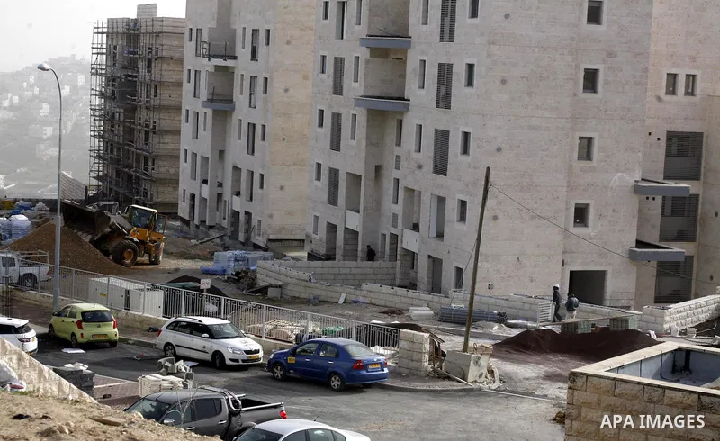 Labourers work at the construction site of a new housing project at the Jewish settlement of Kiryat Moreh in south Jerusalem on December 20, 2012. Israel has approved plans to build 523 homes in the West Bank, Jewish set...