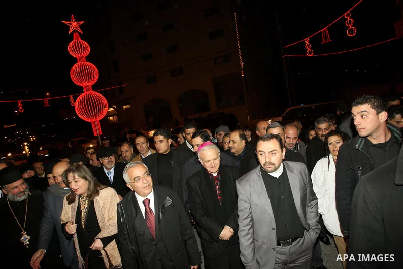 Palestinian Prime Minister Salam Fayyad attends the lighting ceremony of a Christmas tree in the village of Beit Sahour near the West Bank city of Bethlehem on 20 December 2012. Photo by Mustafa Abu Dayeh