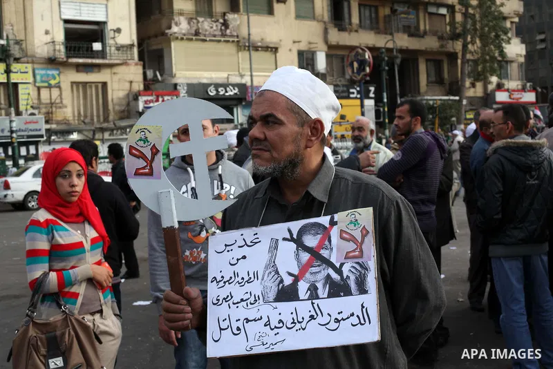 Egyptian protesters gather for a demonstration at Tahrir square in Cairo, Egypt, Friday, Dec. 21, 2012. Running clashes between rival protesters erupted in Egypt's second city Alexandria, on the eve of the final round of...
