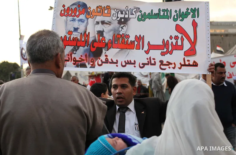Egyptian protesters gather for a demonstration at Tahrir square in Cairo, Egypt, Friday, Dec. 21, 2012. Running clashes between rival protesters erupted in Egypt's second city Alexandria, on the eve of the final round of...
