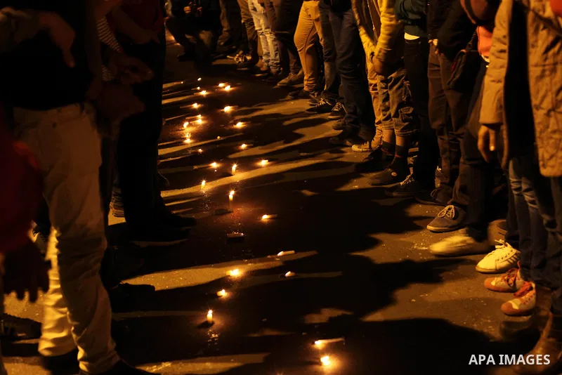 Egyptian protesters place candles as they gather at Tahrir square in Cairo, Egypt, Friday, Dec. 21, 2012. Running clashes between rival protesters erupted in Egypt's second city Alexandria, on the eve of the final round...