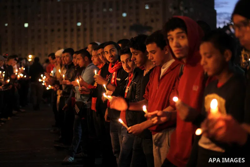 Egyptian protesters hold candles as they gather at Tahrir square in Cairo, Egypt, Friday, Dec. 21, 2012. Running clashes between rival protesters erupted in Egypt's second city Alexandria, on the eve of the final round o...
