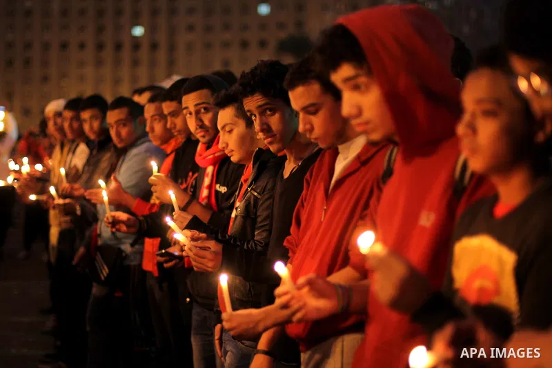Egyptian protesters hold candles as they gather at Tahrir square in Cairo, Egypt, Friday, Dec. 21, 2012. Running clashes between rival protesters erupted in Egypt's second city Alexandria, on the eve of the final round o...