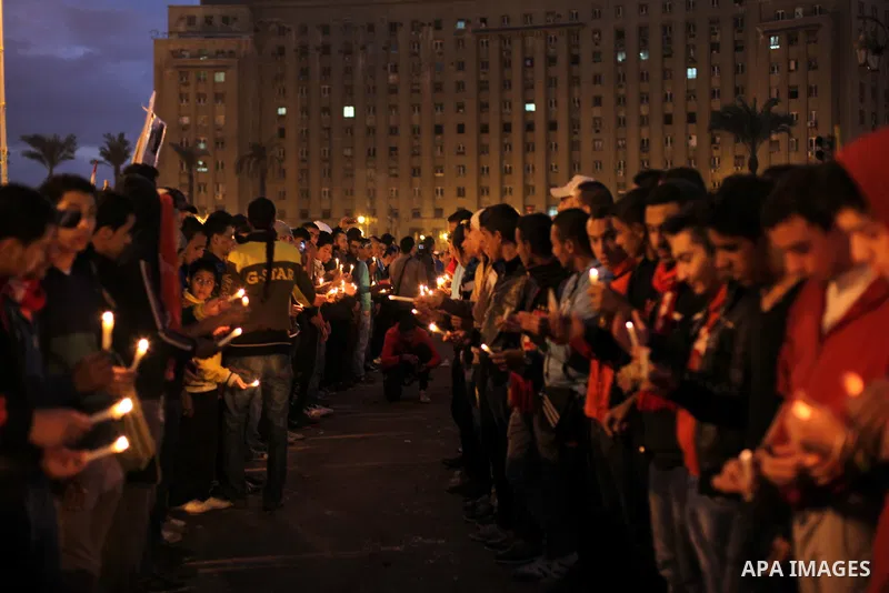 Egyptian protesters hold candles as they gather at Tahrir square in Cairo, Egypt, Friday, Dec. 21, 2012. Running clashes between rival protesters erupted in Egypt's second city Alexandria, on the eve of the final round o...