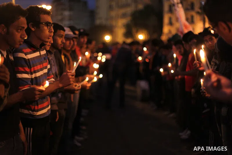 Egyptian protesters hold candles as they gather at Tahrir square in Cairo, Egypt, Friday, Dec. 21, 2012. Running clashes between rival protesters erupted in Egypt's second city Alexandria, on the eve of the final round o...