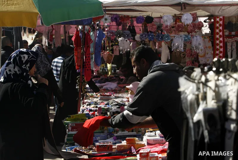 Palestinians shop at the saturday's popular market in Rafah southern Gaza strip on 22 December 2012. Normal life in Gaza resumed remarkably fast after a ceasefire agreement was announced following eight days of cross bor...