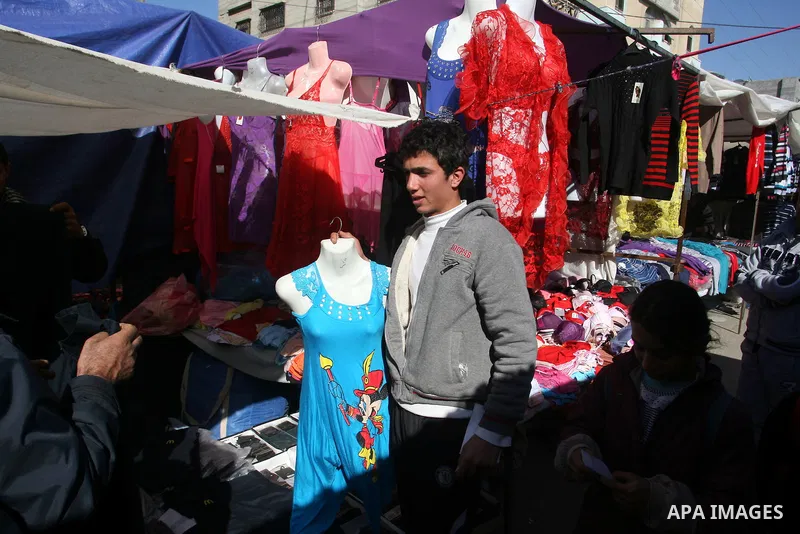 A Palestinian vendor display his goods at the saturday's popular market in Rafah southern Gaza strip on 22 December 2012. Normal life in Gaza resumed remarkably fast after a ceasefire agreement was announced following ei...