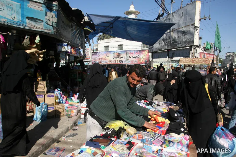 A Palestinian vendor display his goods at the saturday's popular market in Rafah southern Gaza strip on 22 December 2012. Normal life in Gaza resumed remarkably fast after a ceasefire agreement was announced following ei...