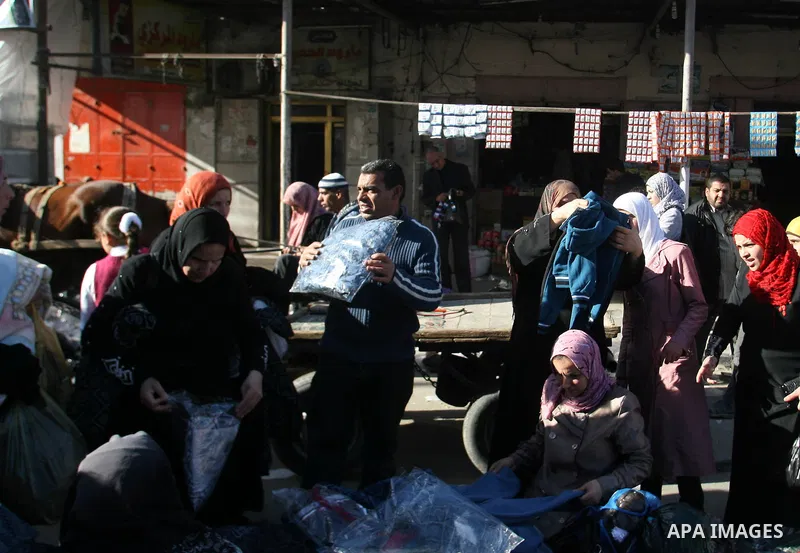 Palestinians shop at the saturday's popular market in Rafah southern Gaza strip on 22 December 2012. Normal life in Gaza resumed remarkably fast after a ceasefire agreement was announced following eight days of cross bor...
