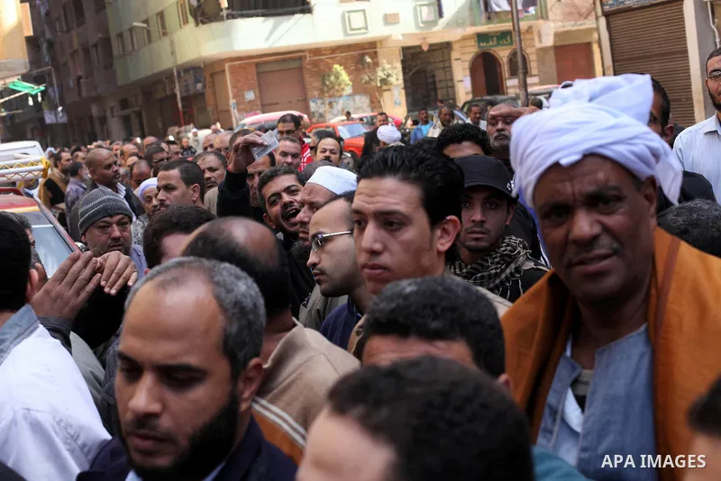 Egyptian voters gather at a polling station during the second round of a referendum on a new draft constitution in Giza, south of Cairo, on December 22, 2012. Egyptians are voting in the final round of a referendum on a...