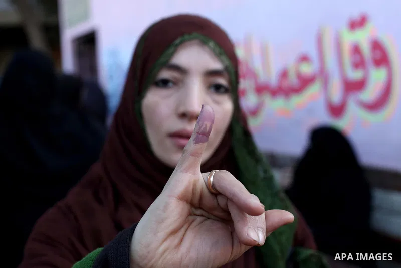 An Egyptian woman shows his ink-stained finger after casting his vote in the final stage of a referendum draft constitution in Cairo, on December 22, 2012. Egyptians are voting in the final round of a referendum on a new...