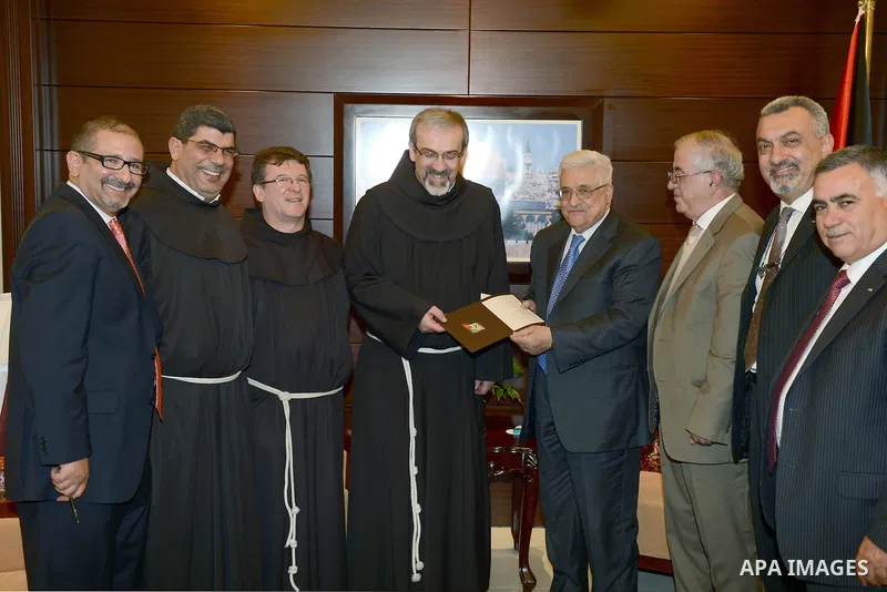 Palestinian President Mahmoud Abbas meets with custos of the Holy Land in the West Bank city of Ramallah on 22 December 2012. Photo by Thaer Ganaim