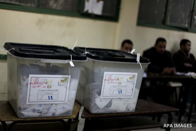 Officials count ballots after polls closed in Giza, south of Cairo, on December 22, 2012. Egyptians are voting in the final round of a referendum on a new constitution championed by President Mohamed Morsi and his Islami...