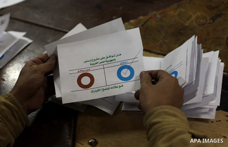 Officials count ballots after polls closed in Giza, south of Cairo, on December 22, 2012. Egyptians are voting in the final round of a referendum on a new constitution championed by President Mohamed Morsi and his Islami...