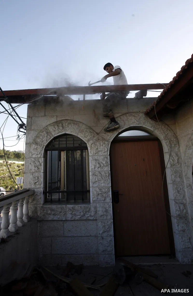 Palestinian youth demolish his house by himself In Wadi Joz in Jerusalem to avoid the high cost of paying for Israeli government bulldozers, or going to prison for not being able to pay, saying the buildings are construc...
