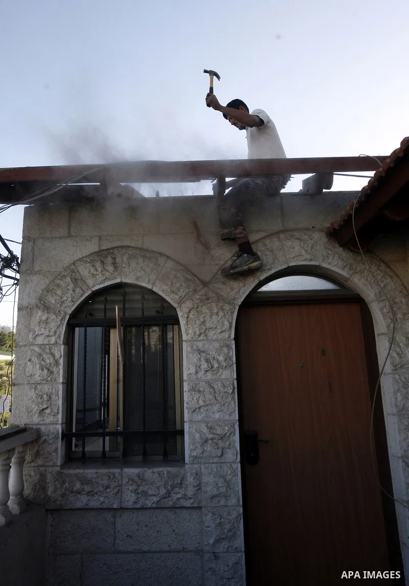 Palestinian youth demolish his house by himself In Wadi Joz in Jerusalem to avoid the high cost of paying for Israeli government bulldozers, or going to prison for not being able to pay, saying the buildings are construc...