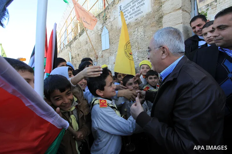 Palestinian Prime Minister Salam Fayyad, during the lighting of the Christmas tree in the church of Burkin in the West Bank of Jenin , on December 23, 2012. Photo by Mustafa Abu Dayeh