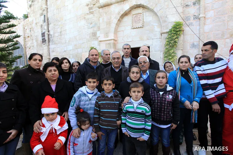 Palestinian Prime Minister Salam Fayyad, during the lighting of the Christmas tree in the church of Burkin in the West Bank of Jenin , on December 23, 2012. Photo by Mustafa Abu Dayeh