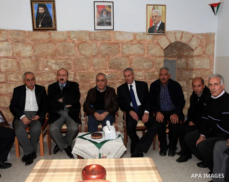 Palestinian Prime Minister Salam Fayyad, during the lighting of the Christmas tree in the church of Burkin in the West Bank of Jenin , on December 23, 2012. Photo by Mustafa Abu Dayeh