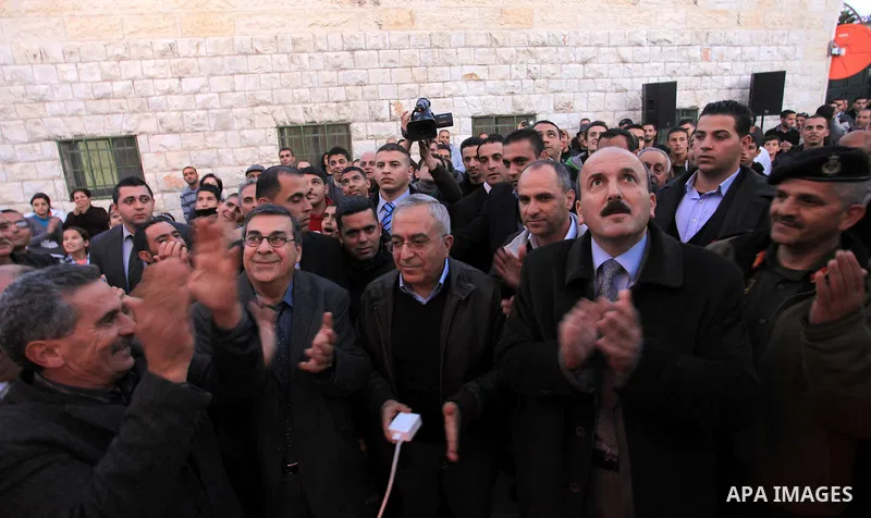 Palestinian Prime Minister Salam Fayyad, during the lighting of the Christmas tree in the church of Latin in the West Bank village of Zababda of Jenin , on December 23, 2012. Photo by Mustafa Abu Dayeh