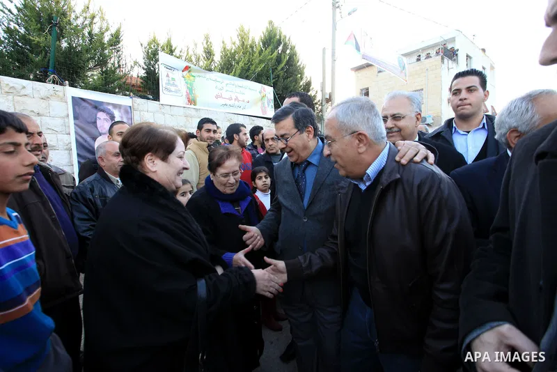 Palestinian Prime Minister Salam Fayyad, during the lighting of the Christmas tree in the church of Latin in the West Bank village of Zababda of Jenin , on December 23, 2012. Photo by Mustafa Abu Dayeh