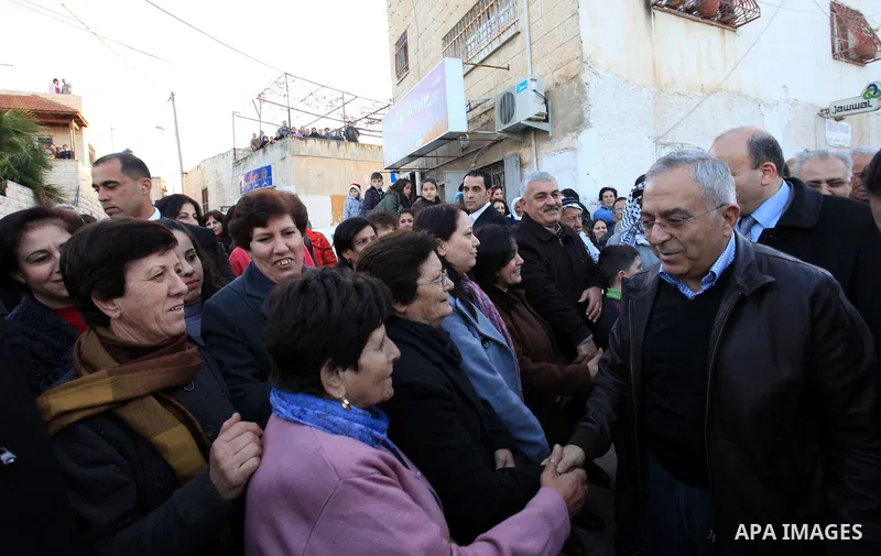 Palestinian Prime Minister Salam Fayyad, during the lighting of the Christmas tree in the church of Latin in the West Bank village of Zababda of Jenin , on December 23, 2012. Photo by Mustafa Abu Dayeh