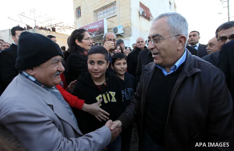 Palestinian Prime Minister Salam Fayyad, during the lighting of the Christmas tree in the church of Latin in the West Bank village of Zababda of Jenin , on December 23, 2012. Photo by Mustafa Abu Dayeh
