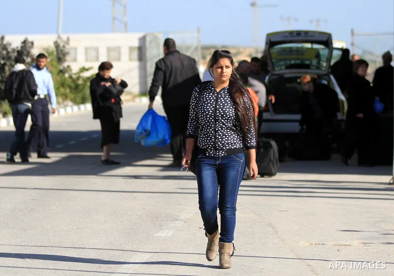 A Palestinian Christian walks towards Erez crossing in the northern Gaza Strip on Dec. 24, 2012 after Israel granted 557 permits for Christians from the isolated and impoverished territory to travel to the West Bank town...
